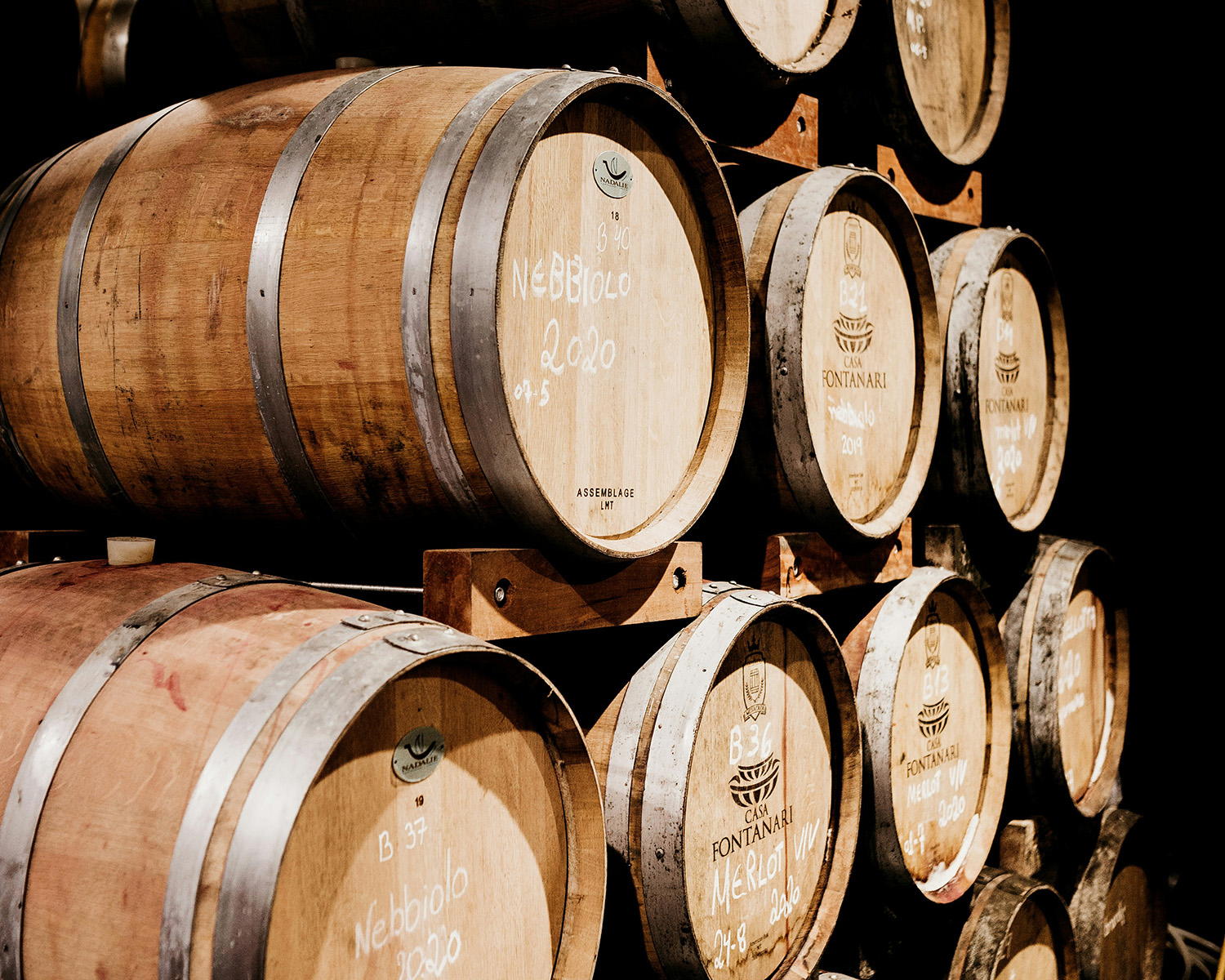 Oak barrels inside a McLaren Vale winery cellar
